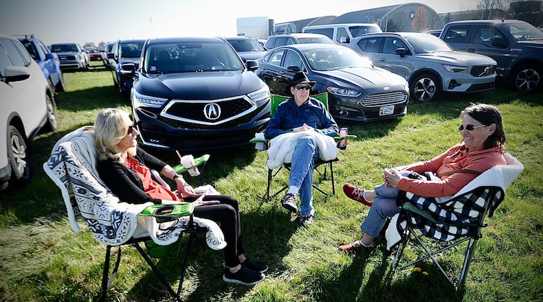 Visiting the National Museum of the United States Air Force to watch the eclipse on Monday, April 8, 2024, from left, Barb Shank of West Chester Twp. and relatives Nick and Patti Kirch from Washington state. MARSHALL GORBY \STAFF