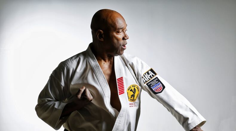 Lifelong Hamilton resident Bob “Moo Duk Kwan” Harris has been teaching karate since 1969, including more than 35 years of teaching at the Hamilton YMCA and his own studio. He has reached Supreme Nim Grand Master status in karate and and is a two-time national champion. Harris operates his photography business and Moo Duk Kwan Karate Temple at his South Second Street studio. NICK GRAHAM/STAFF