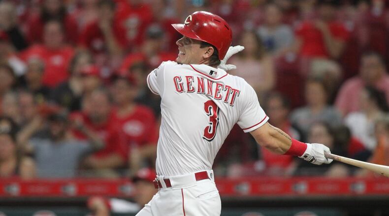 The Reds’ Scooter Gennett doubles to drive in a run in the first inning against the Pirates on Tuesday, May 22, 2018, at Great American Ball Park in Cincinnati. David Jablonski/Staff