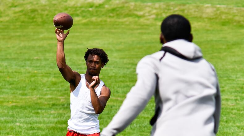 The city of Fairfield has seen an increase in use of its parks since the start of the novel coronavirus, or COVID-19, pandemic. Picture is Princeton graduate Jalen Turner throwing a pass to graduate Elijah Eberhardt in April at Harbin Park in Fairfield preparing for college athletics. Eberhardt is set to play football at Bowling Green State University and Turner is set to run track for a college in Georgia. NICK GRAHAM/STAFF