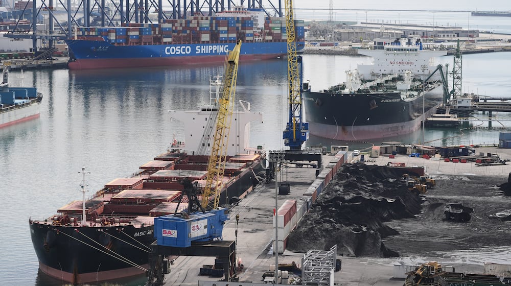 Ships are docked at the Port of Long Beach Friday, Feb. 20, 2026, in Long Beach, Calif. (AP Photo/Damian Dovarganes)