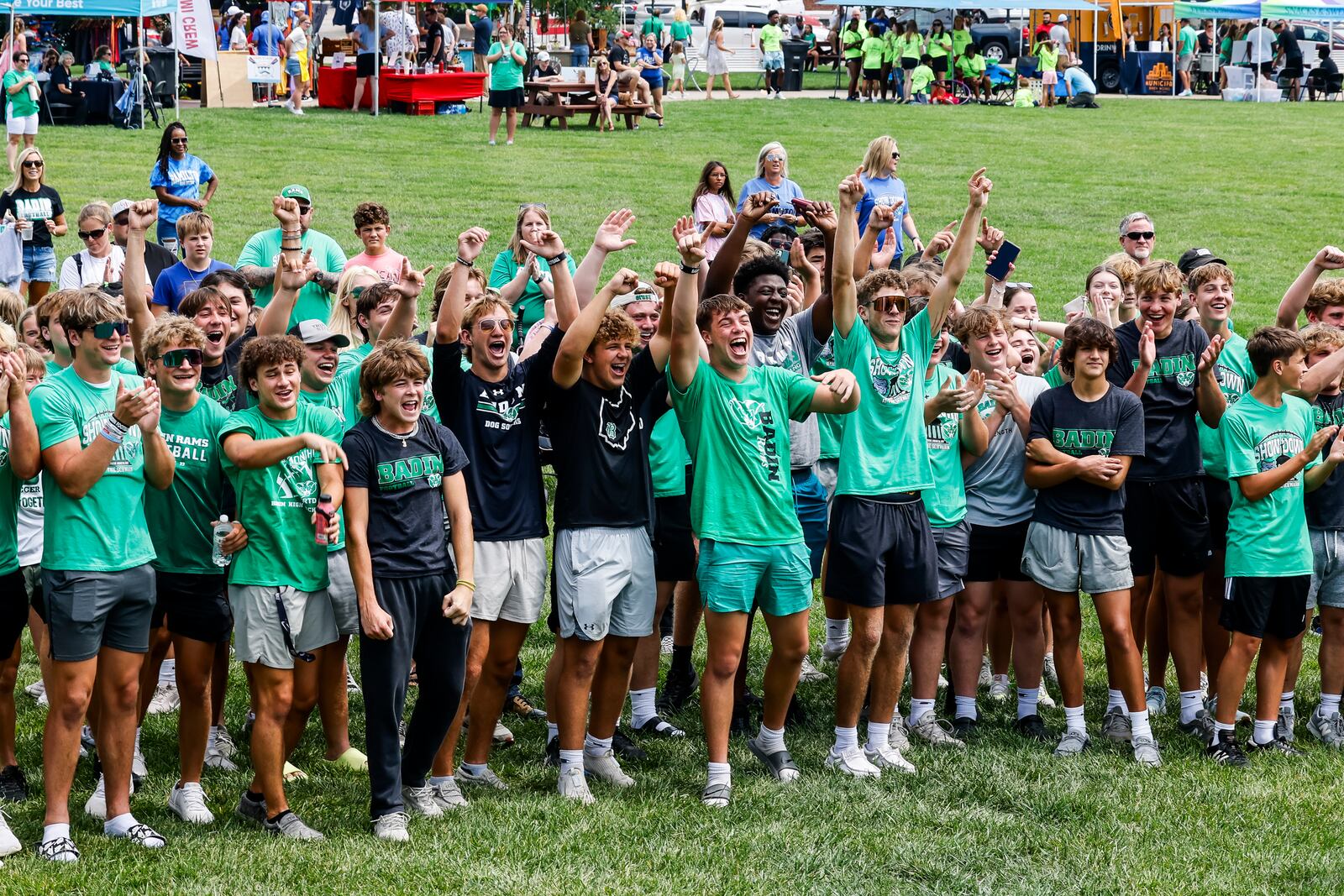 Hamilton Big Blue and Badin Rams football players, cheerleaders and fans gathered for a combined pep rally with tug of war, chicken wing eating contest, footlong coney making contest and more Saturday, Aug. 12, 2023 at Marcum Park in Hamilton. Hamilton plays Badin next Friday. NICK GRAHAM/STAFF