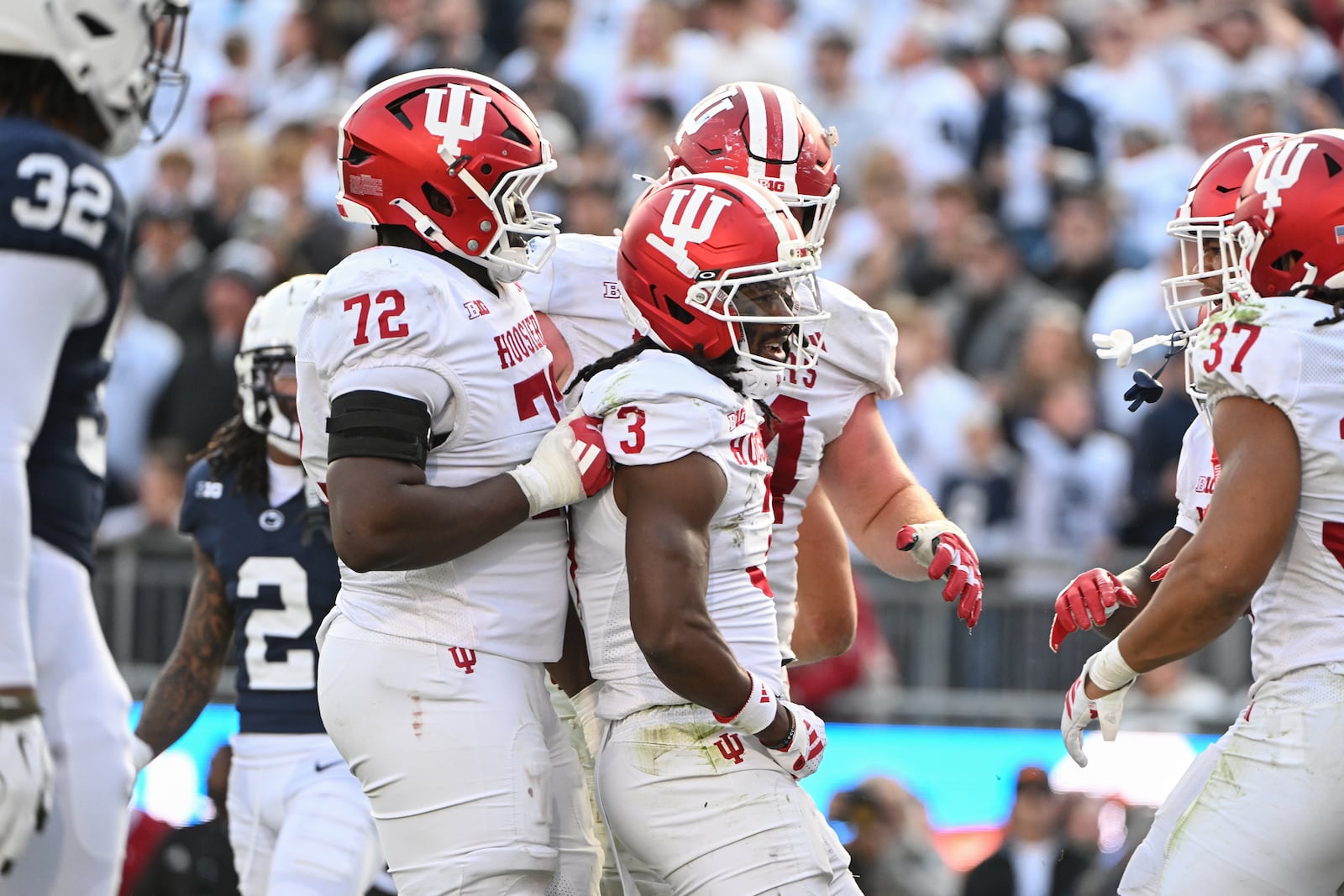 Indiana wide receiver Omar Cooper Jr. (3) celebrates a touchdown pass with offensive lineman Adedamola Ajani (72) during the fourth quarter of an NCAA college football game  against Penn State, Saturday, Nov. 8, 2025, in State College, Pa. (AP Photo/Barry Reeger)