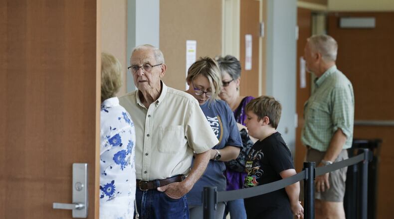 Voters line up to cast their ballots on the first day of early voting for the Issue 1 special election Tuesday, July 11, 2023 at Butler County Board of Elections in Hamilton. NICK GRAHAM/STAFF