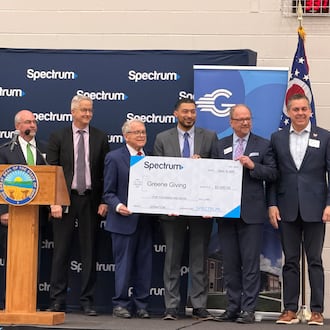 Ohio Governor Mike DeWine and leaders from the Dayton Development Coalition and Spectrum internet celebrate a milestone in the company's rural broadband expansion project. LONDON BISHOP/STAFF