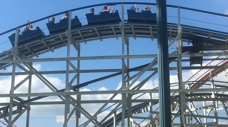 People ride a roller coaster at Stricker's Grove, a small amusement park in Ross. FILE