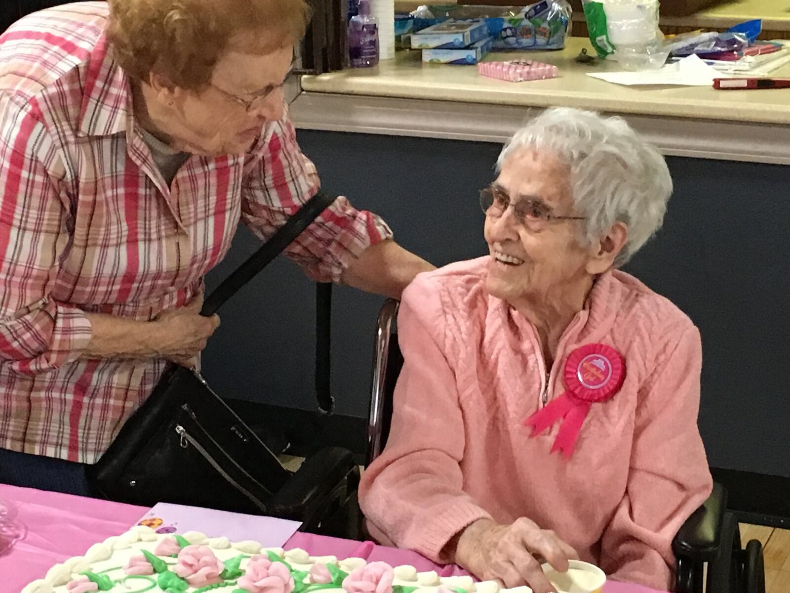 Family, friends and Hospice Care of Middletown employees helped Maneva Williams celebrate her 104th birthday Saturday at a Trenton church. RICK McCRABB/STAFF