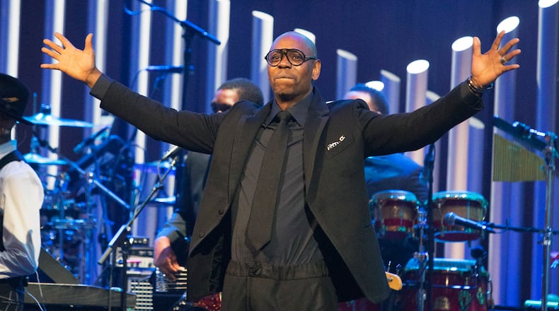 FILE - In this Oct. 27, 2019 file photo, Dave Chappelle is honored with the Mark Twain Prize for American Humor at the Kennedy Center for the Performing Arts in Washington. Chappelle, Jon Stewart, Jimmy Fallon and Amy Schumer are in a star-studded group of comedians to perform Sept. 12, 2021, for one night only at Madison Square Garden to mark the 20th anniversary of 9/11. All proceeds from “NYC Still Rising After 20 Years: A Comedy Celebration” will benefit 9/11 charities. (Photo by Owen Sweeney/Invision/AP, File)