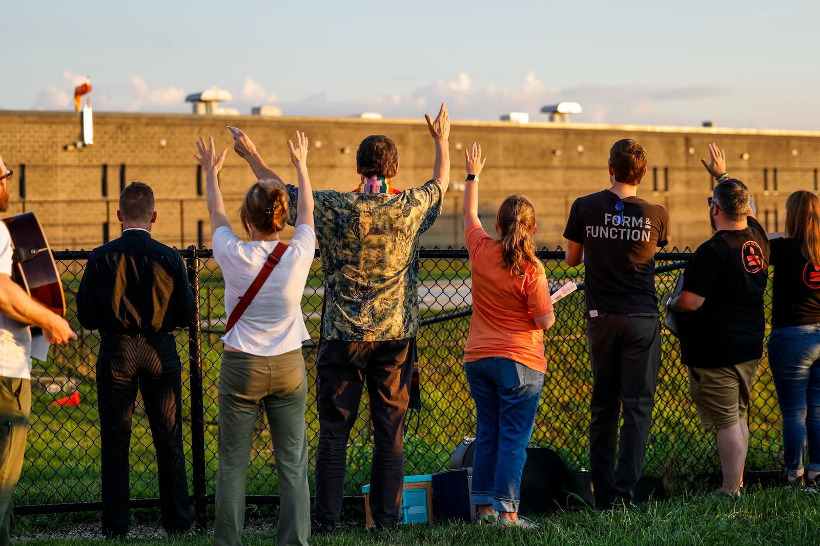 Over 100 faith leaders and advocates hold a candlelight vigil for Alonzo Tomas Mendez and other immigrants being held in Butler County Jail Tuesday, July 1, 2025 just outside the fence of the Butler County Sheriff's Office in Hamilton. NICK GRAHAM/STAFF