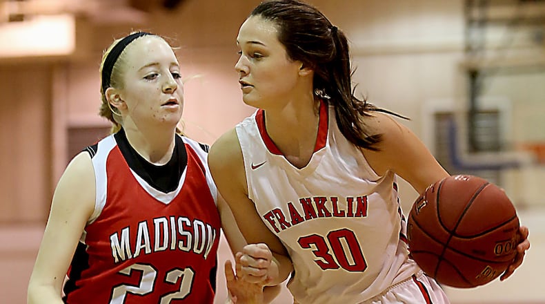 Franklin’s Layne Ferrell is covered by Madison’s Lily Campbell during the consolation game in the Miami University Middletown Holiday Tournament on Dec. 30, 2016. COX MEDIA FILE PHOTO