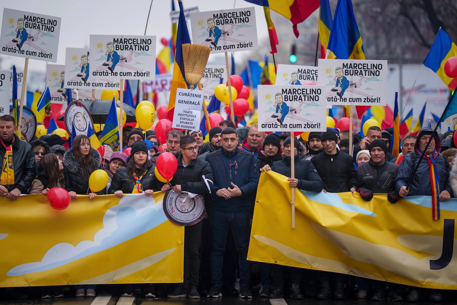 FILE - George Simion, center, presidential candidate for the Alliance for the Union of Romanians (AUR) stands during a protest calling for the resignation of the country's Prime Minister Marcel Ciolacu in Bucharest, Romania, Saturday, March 1, 2025. (AP Photo/Vadim Ghirda, File)