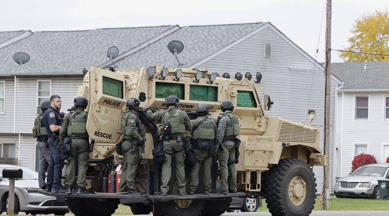 The Middletown SWAT team this morning pulls into an apartment complex off Hendrickson Road. NICK GRAHAM/STAFF