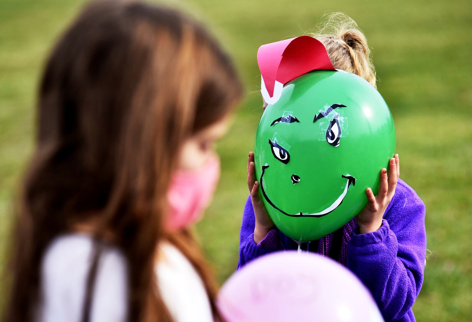 The second grade classes at Fairfield South Elementary School decorated balloons for a parade outside for other students Tuesday, Nov. 24, 2020 on Bibury Road in Fairfield. NICK GRAHAM / STAFF