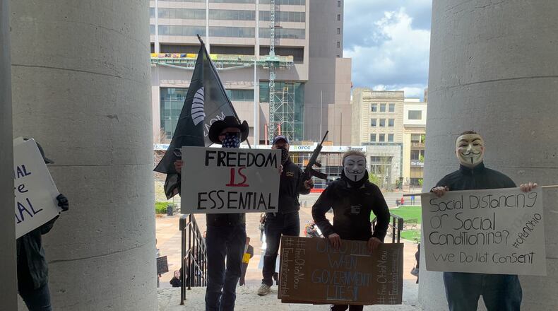 Dozens of protesters were outside the Statehouse in Columbus April 9, 2020. LAURA A. BISCHOFF / STAFF