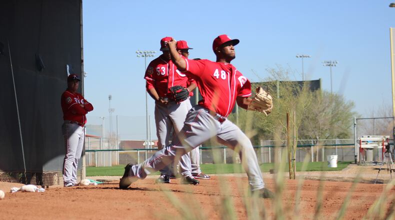Reds manager watches some pitchers during a spring training workout on Monday, Feb. 23 in Goodyear, Ariz. Mike Hartsock/Staff