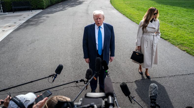Accompanied by first lady Melania Trump, President Donald Trump stops to speak to reporters as he leaves the White House for the trip to Italy, where they are to attend the funeral of Pope Francis, on Friday morning, April 25, 2025. President Trump says he and Xi Jinping, China’s president, have spoken about tariffs, but Chinese officials rejected his claims. (Haiyun Jiang/The New York Times)
