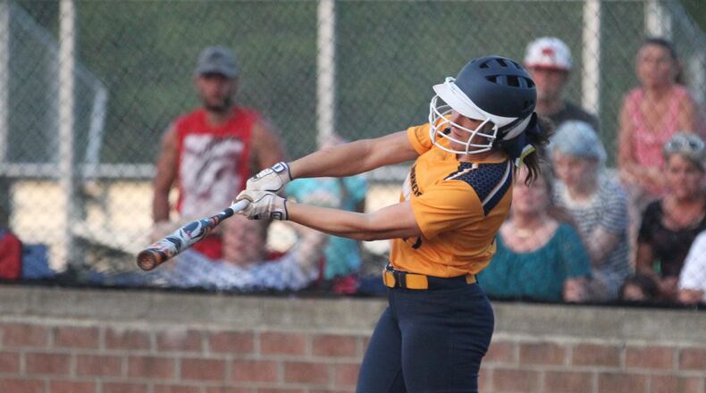 Monroe’s Faith Hensley homers in the final at-bat of her prep career during a Division II district final against Springfield Kenton Ridge on May 20 at Brookville. DAVID JABLONSKI/STAFF