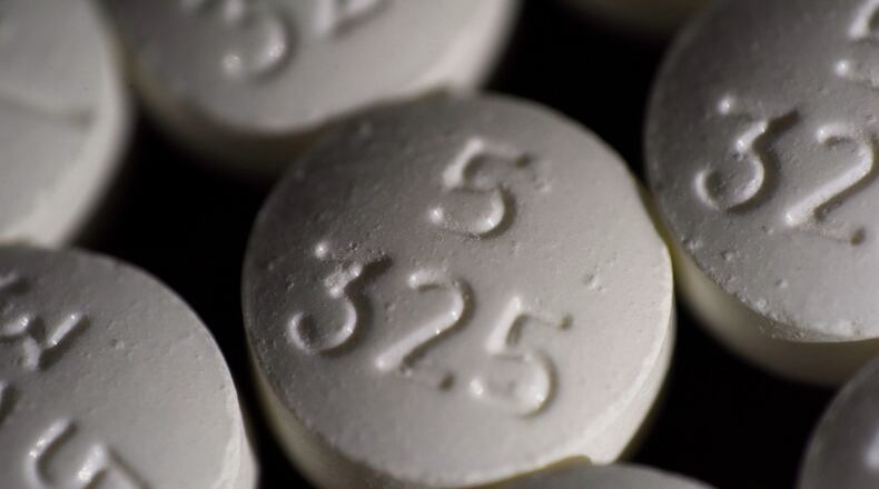 FILE - An arrangement of pills of the opioid oxycodone-acetaminophen in New York. (AP Photo/Patrick Sison, File)