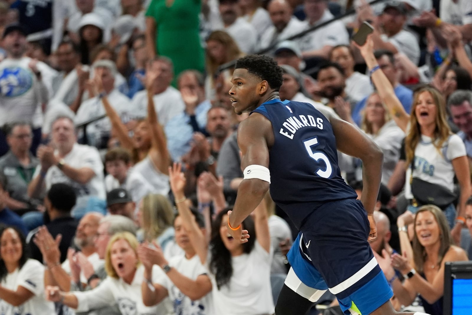 Minnesota Timberwolves guard Anthony Edwards (5) celebrates after scoring during the second half of Game 5 of an NBA basketball second-round playoff series against the Golden State Warriors, Wednesday, May 14, 2025, in Minneapolis. (AP Photo/Abbie Parr)