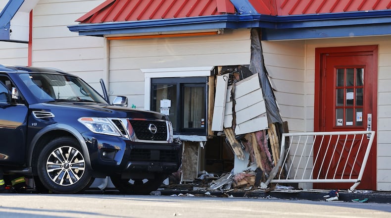 A vehicle crashed inro Jocko's Chicken and Seafood on Hogh Street in Hamilton Wednesday, Dec. 27, 2023. NICK GRAHAM/STAFF