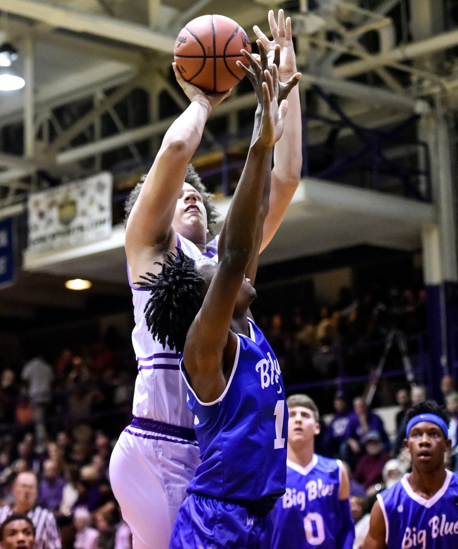 Middletown’s Chris Stallworth puts up a shot over Hamilton’s Bryan Henderson during Friday night’s game at Wade E. Miller Gym in Middletown. NICK GRAHAM/STAFF