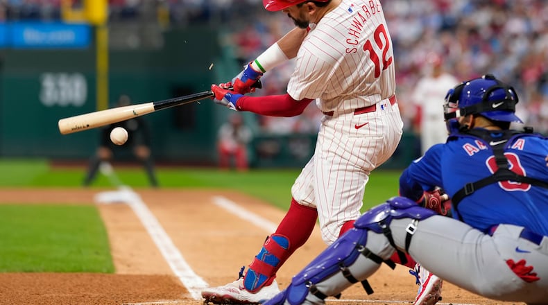 Philadelphia Phillies' Kyle Schwarber breaks his bat on a ground out against Chicago Cubs pitcher Javier Assad during the first inning of a baseball game, Wednesday, Sept. 25, 2024, in Philadelphia. (AP Photo/Matt Slocum)