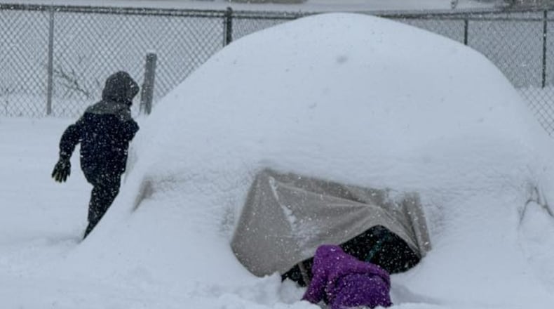 Kids are having fun playing in the snow. A major, historic snowstorm moving across the U.S. on Sunday has already left 8-10 inches of snow in southwest Ohio as it moved northeast. CONTRIBUTED