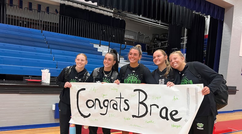 Badin’s Braelyn Even (center) celebrates with her teammates after becoming the school’s all-time leading scorer in basketball. CHRIS VOGT / CONTRIBUTED