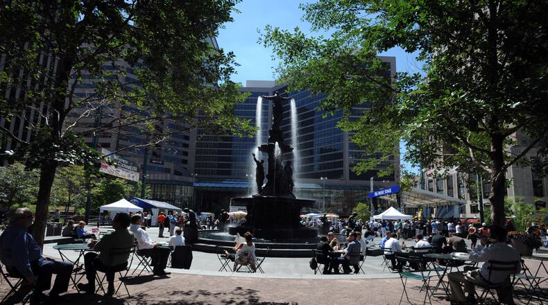 Hundreds of people eat, socialize and hold events during lunch hour on Fountain Square in Cincinnati. FILE