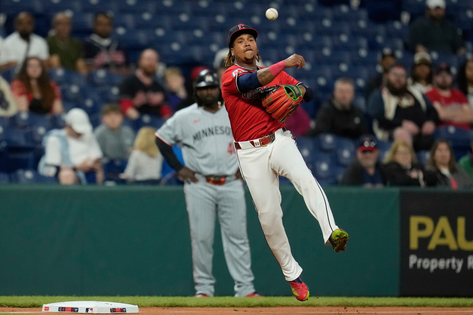 Cleveland Guardians third baseman Jose Ramirez (11) throws out Minnesota Twins' Ty France at first base in the first inning of a baseball game in Cleveland, Tuesday, April 29, 2025. (AP Photo/Sue Ogrocki)