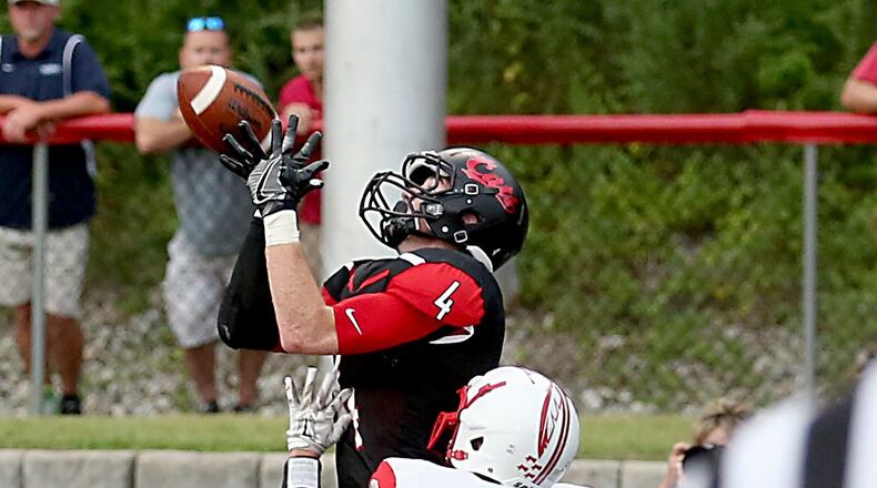 Franklin wide receiver Noah Kremer hauls in a touchdown pass against Carlisle’s Braden Rauch at Atrium Stadium in Franklin on Friday night. CONTRIBUTED PHOTO BY E.L. HUBBARD