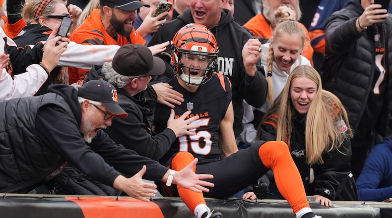 Cincinnati Bengals wide receiver Charlie Jones (15) celebrates his opening kickoff return touchdown during the first half of an NFL football game against the Chicago Bears, Sunday, Nov. 2, 2025, in Cincinnati. (AP Photo/Joshua A. Bickel)