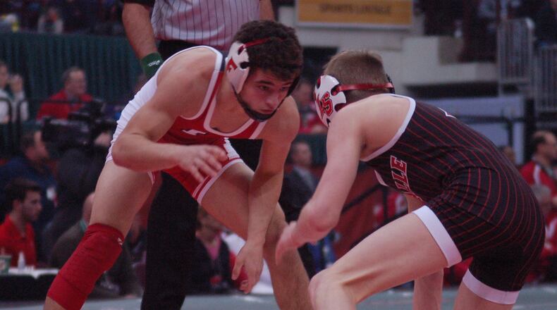 Fairfield’s Zach Shupp looks for an opening to attack during his 106-pound Division I title match with LaSalle’s Dustin Norris Saturday night at the Schottenstein Center. Shupp claimed the state title with a 3-1 win. John Cummings/CONTRIBUTED