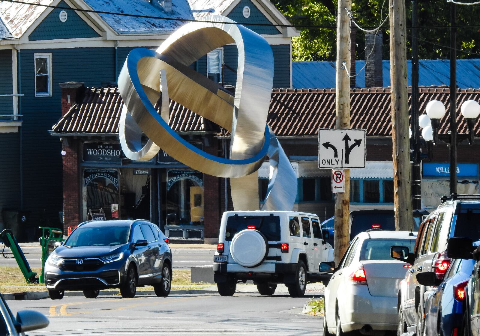 The 25-foot-tall ‘Embrace’ sculpture was delivered and installed at the intersection of Main Street, Millville Avenue and Eaton Avenue Wednesday, October 7, 2020 in Hamilton. The sculture was created in Arkansas and was hauled by truck to Hamilton. NICK GRAHAM /STAFF