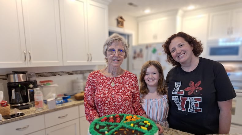 Preparing for the Ohio State Fair in a one-day baking marathon are
(left to right) Christine Olinsky, her granddaughter Anna and her daughter Rebecca.
CONTRIBUTED