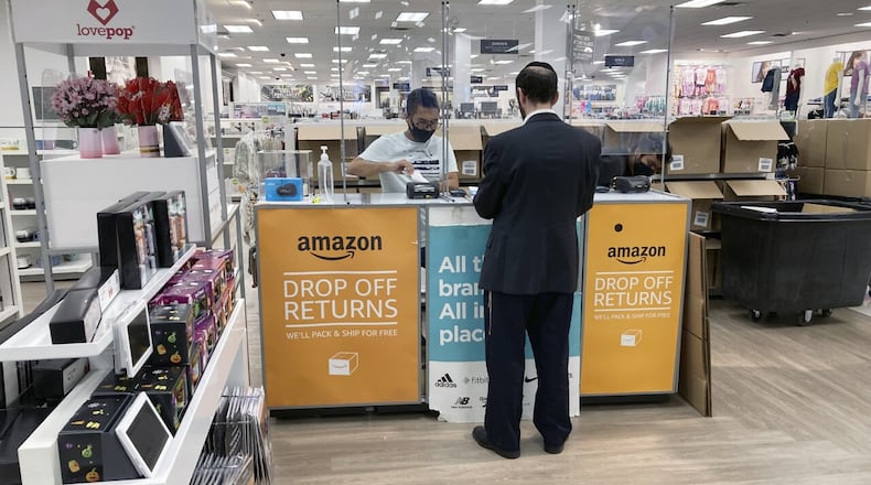 People return items purchased online at an Amazon counter inside a Kohl's department store in Clifton, New Jersey, on Sept. 3, 2021. TED SHAFFREY/AP/WCPO