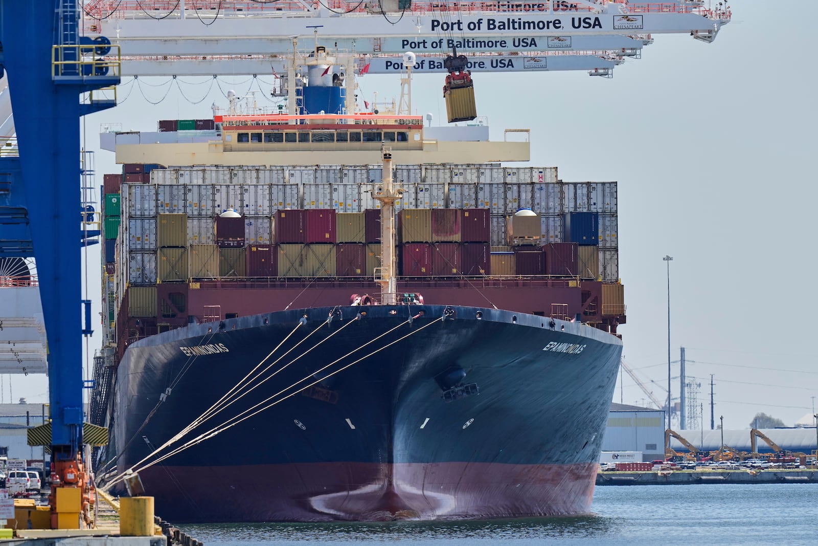 A crane lifts an imports container from the cargo ship Epaminondas while it is docked at the Port of Baltimore, Wednesday, April 9, 2025, in Baltimore. (AP Photo/Stephanie Scarbrough)