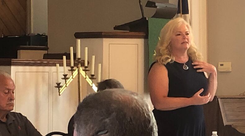 Amy Schenck, Madison Twp.'s fiscal officer, addresses those who attended a special meeting Monday night to discuss a recent state audit that was critical of the township. RICK McCRABB/STAFF