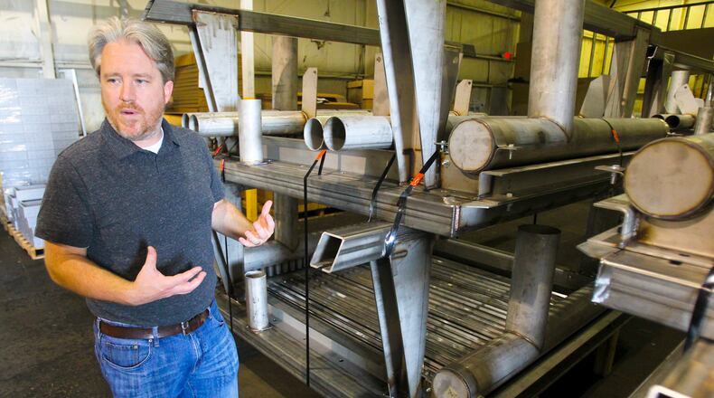 Marvin Cunningham, President of Long-Stanton Manufacturing Co., gives a tour of their West Chester Twp. facility in 2014. STAFF FILE/2014