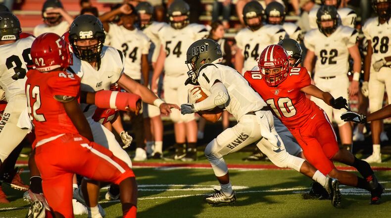 Fairfield’s Rudy Jones (10) prepares to tackle Lakota East’s Jeff Garcia during their game Sept. 15 at Fairfield Stadium. That’s the Tribe’s Allen Caldwell (42) coming from the opposite side. Host Fairfield won 48-14. NICK GRAHAM/STAFF