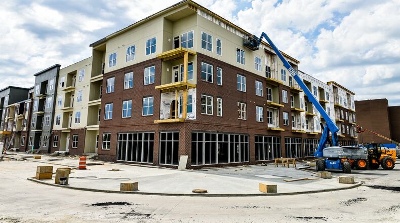 Construction continues May 9 on The Marcum building that includes living and retail space in Hamilton. NICK GRAHAM/STAFF