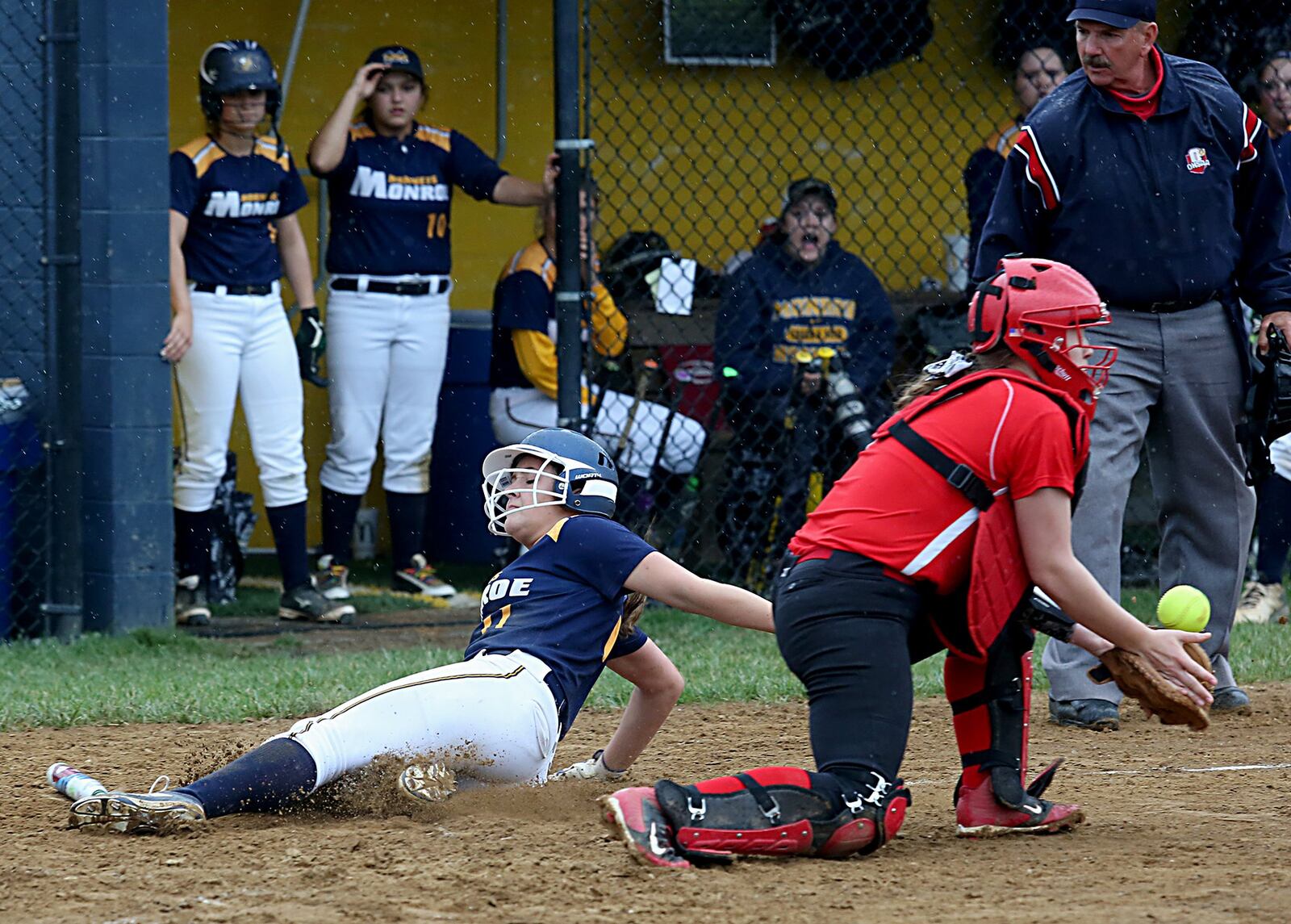 Monroe’s Faith Hensley slides across the plate as Franklin catcher Tara Johnson takes the throw during their game at Monroe on May 3. CONTRIBUTED PHOTO BY E.L. HUBBARD
