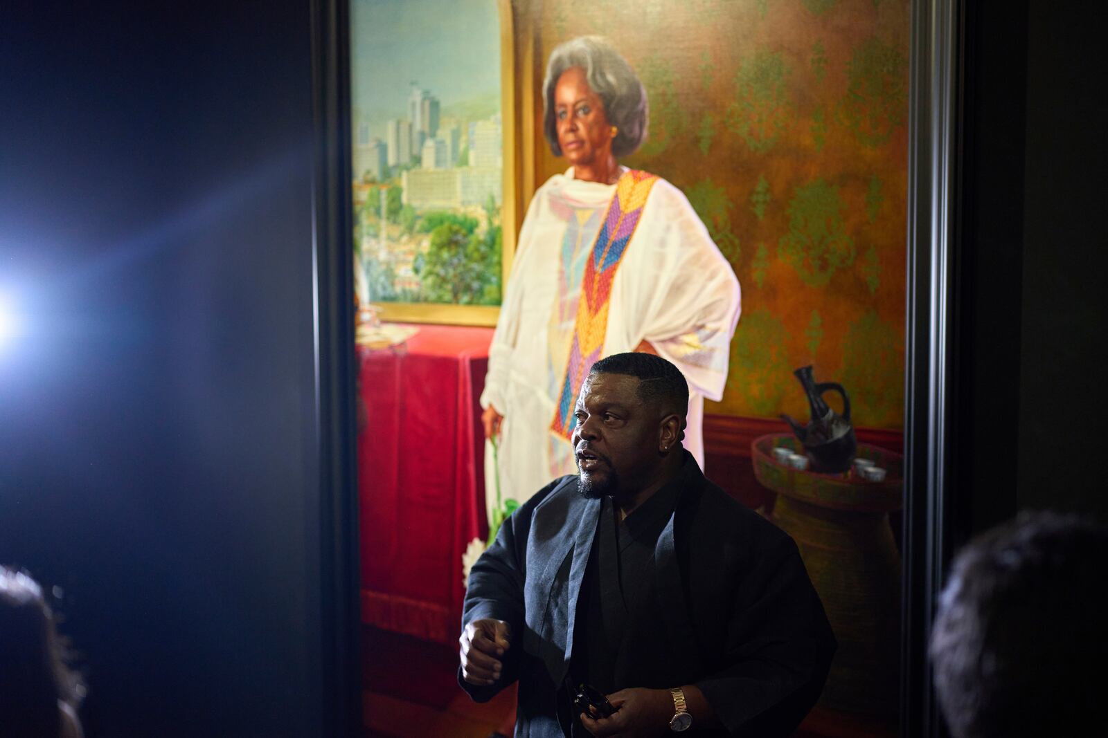 American painter Kehinde Wiley stands in front of a portrait of Sahle-Work Zewde, former president of Ethiopia during the opening of his exhibition A Maze of Power in Mohammed VI Museum of Modern and Contemporary Art, in Rabat, Tuesday, April 15, 2025. (AP Photo/Mosa'ab Elshamy)