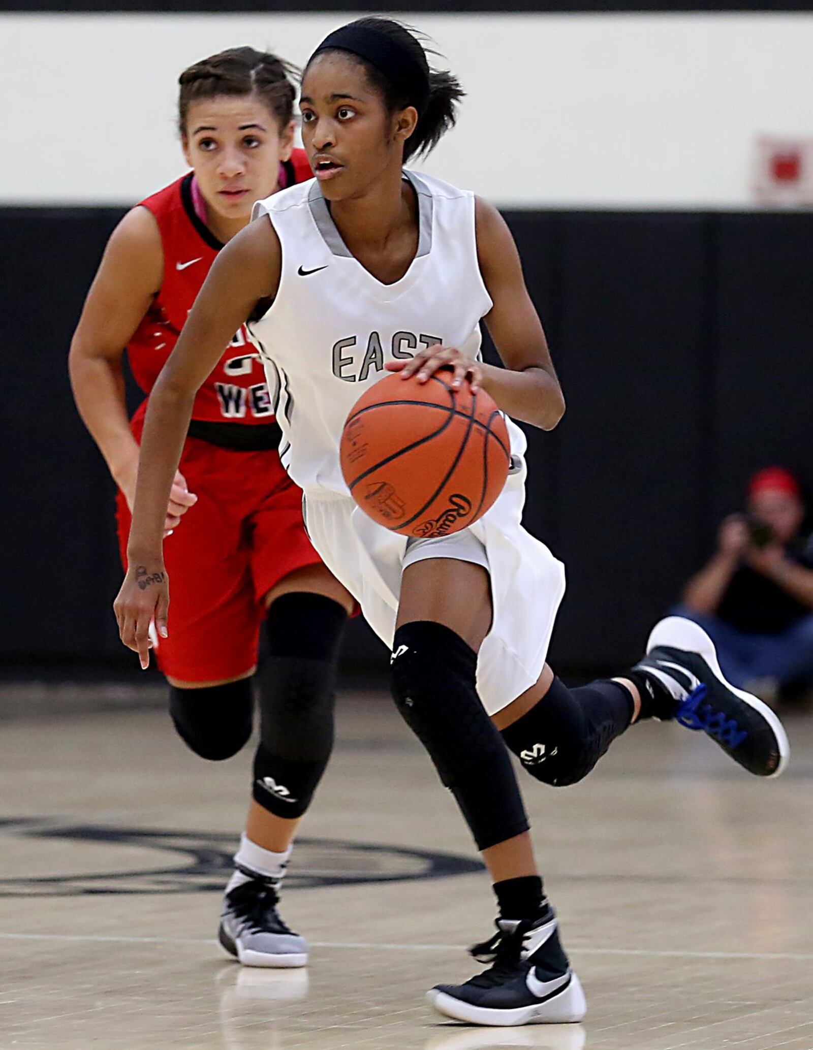 Lakota East guard Shaniyah Reese is pursued by Lakota West guard Sarah Jones during Wednesday night’s game in Liberty Township. CONTRIBUTED PHOTO BY E.L. HUBBARD