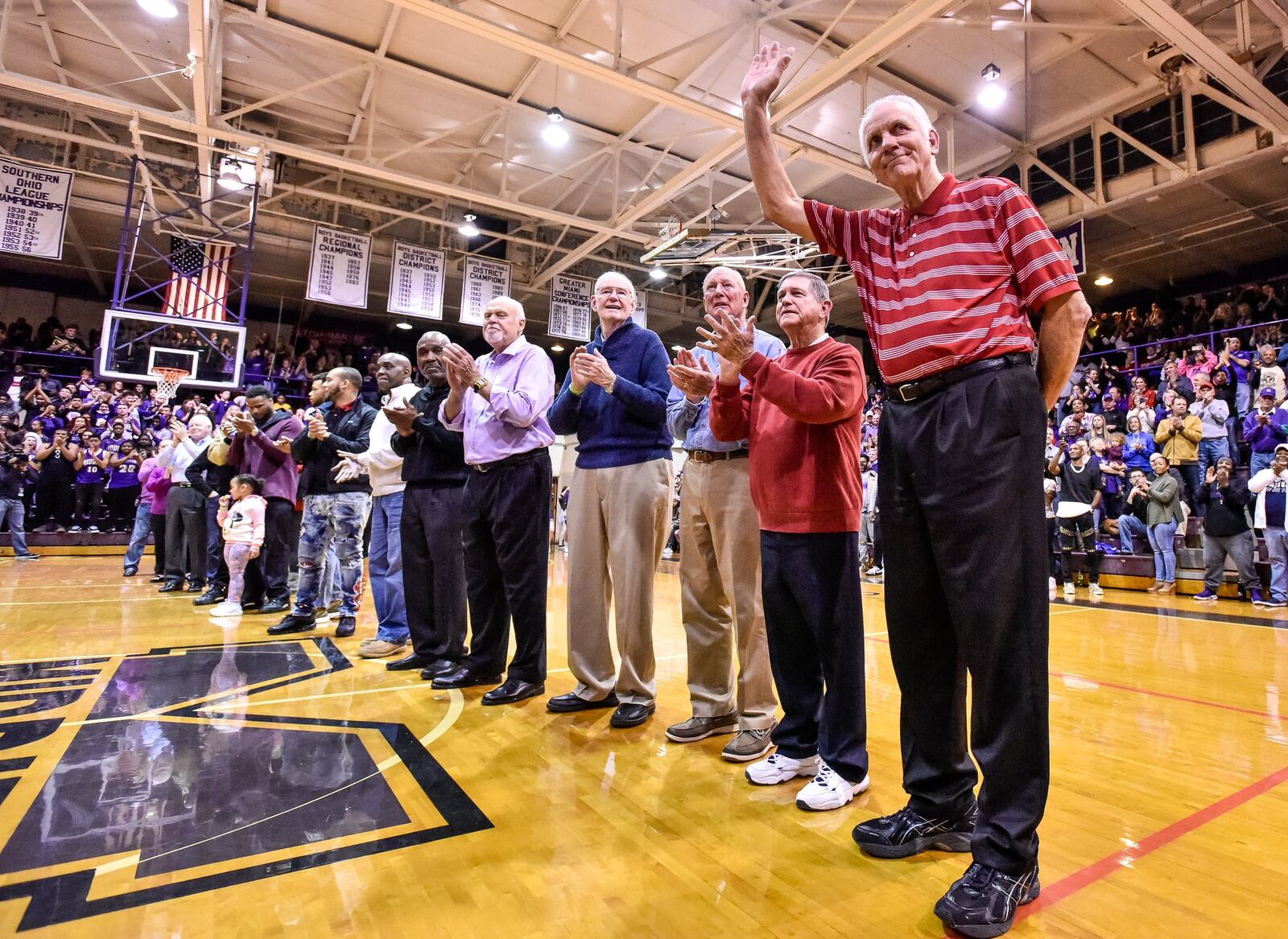 Jerry Lucas (right) was one of numerous former Middletown basketball players honored before Friday night’s game against visiting Hamilton at Wade E. Miller Gym in Middletown. NICK GRAHAM/STAFF