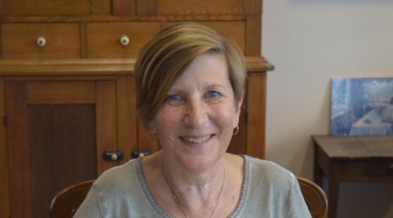 Tad Liechty is pictured with copies of her books produced by Berg Kaufman Publishing. CONTRIBUTED/BOB RATTERMAN