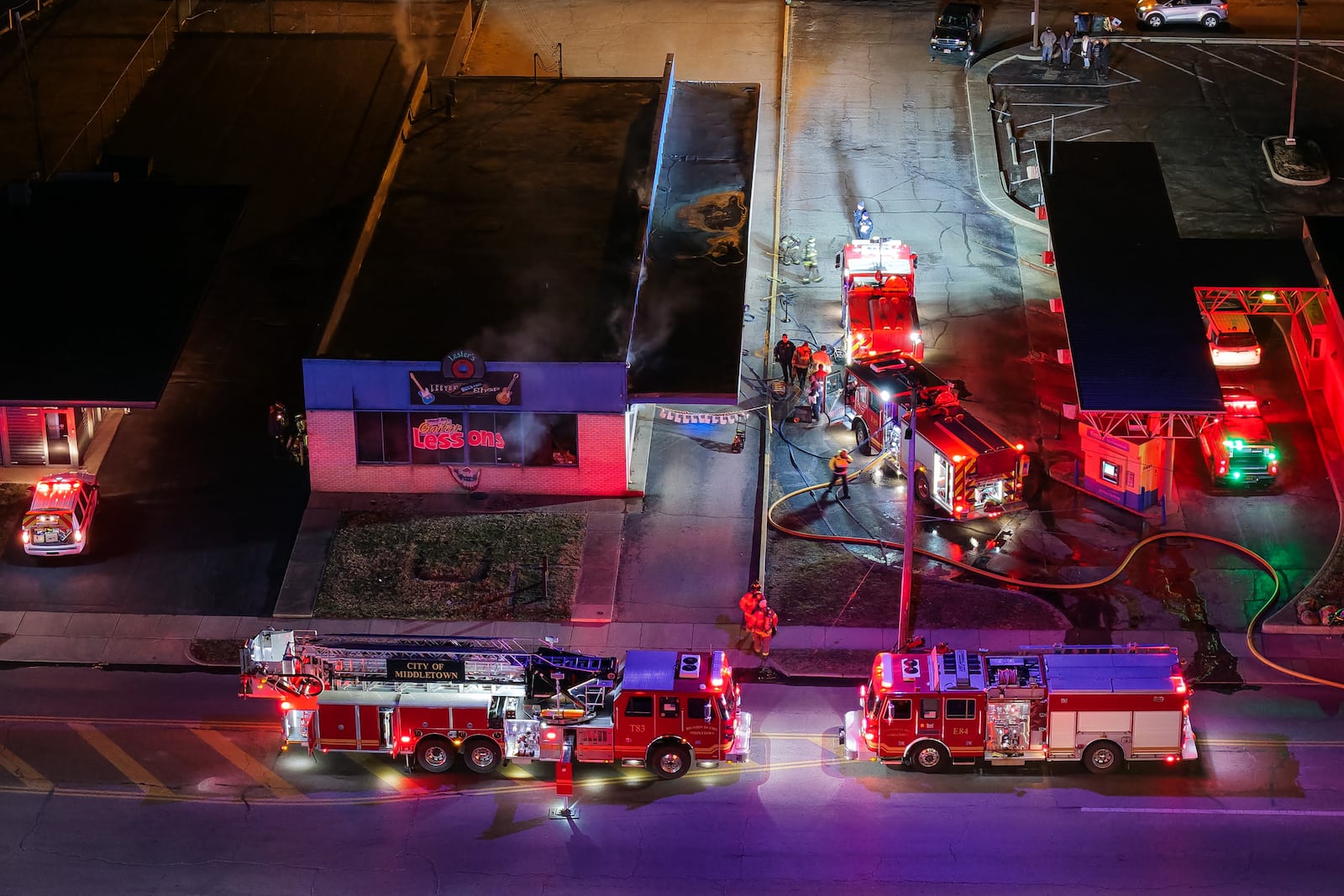 Emergency crews extinguish a fire at Lester's Rock N Roll Shop Tuesday, Jan. 20, 2026 on Central Avenue in Middletown. NICK GRAHAM/STAFF
