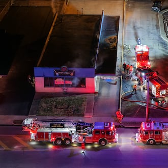 Emergency crews extinguish a fire at Lester's Rock n Roll Shop Tuesday, Jan. 20, 2026 on Central Avenue in Middletown. NICK GRAHAM/STAFF