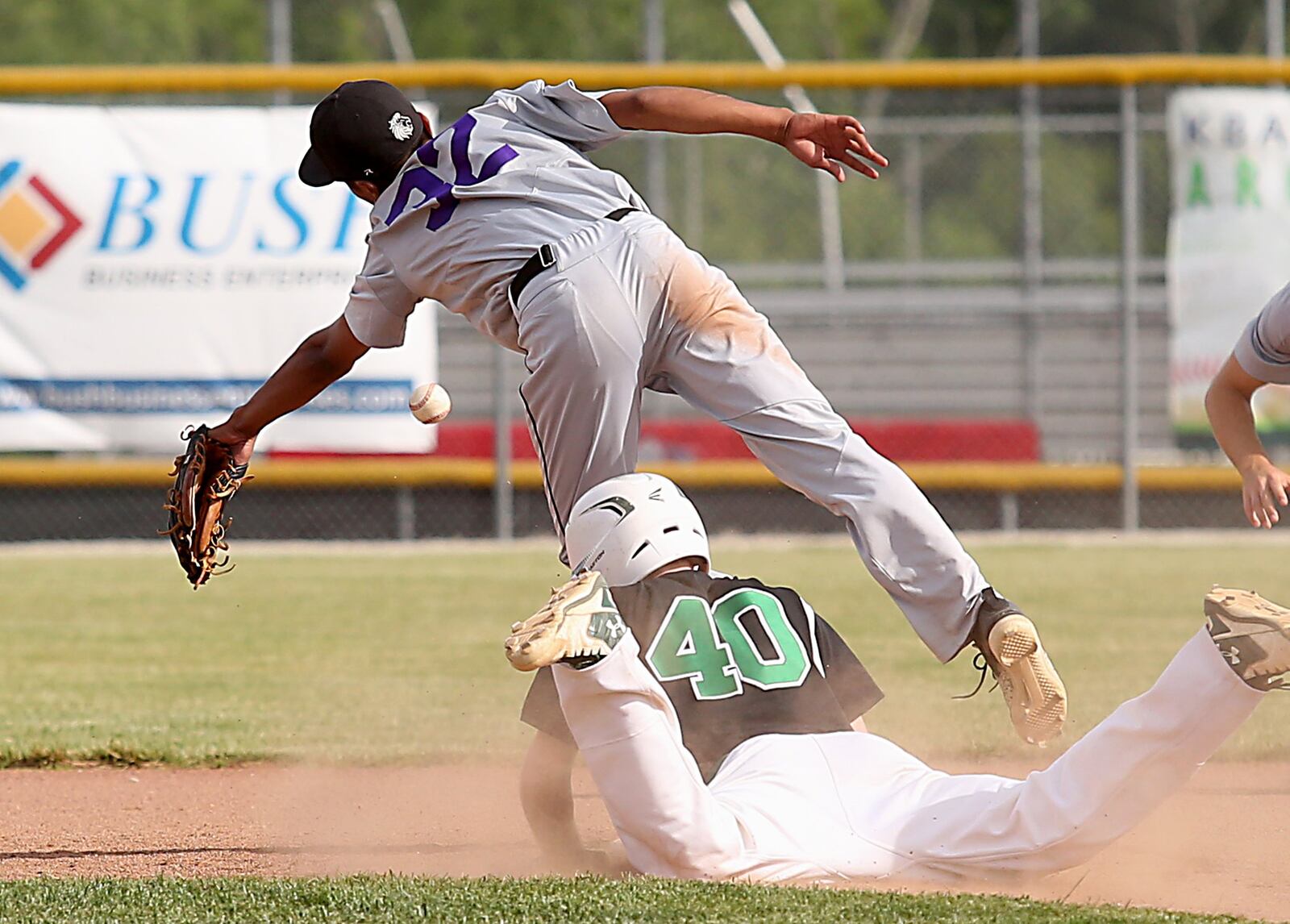 New Miami’s Jaden Phillips steals second as Miami Valley Christian Academy second baseman Gavin Bangert chases a bad throw Wednesday during a Division IV sectional final at Kings. CONTRIBUTED PHOTO BY E.L. HUBBARD