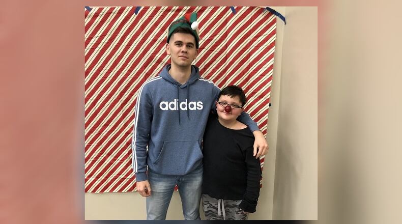 Dzhamal Sarvalov, 23, of Liberty Twp., was matched with Mikhail Stepp, 11, of Hamilton, last year through the Butler County Big Brothers/Big Sisters program. They attended the organization’s holiday party last year. SUBMITTED PHOTO